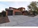 Lovely home with a large driveway and attached three car garage at 8776 W Peppertree Ln, Glendale, AZ 85305