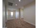 This hallway features neutral walls and carpeted flooring at 8776 W Peppertree Ln, Glendale, AZ 85305