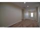 This hallway features neutral walls and carpeted flooring at 8776 W Peppertree Ln, Glendale, AZ 85305