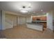 Spacious open kitchen featuring an island, tile floors, and stainless steel appliances at 8776 W Peppertree Ln, Glendale, AZ 85305