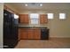 Updated kitchen featuring stainless steel appliances, wood cabinets, and tile flooring at 8776 W Peppertree Ln, Glendale, AZ 85305