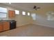 Bright kitchen features tile floors, wood cabinets, modern appliances and lots of natural light at 8776 W Peppertree Ln, Glendale, AZ 85305