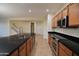 Bright kitchen featuring a center island, stainless appliances, and tile flooring at 8776 W Peppertree Ln, Glendale, AZ 85305