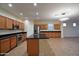 Spacious kitchen featuring a center island, stainless appliances, and tile flooring at 8776 W Peppertree Ln, Glendale, AZ 85305