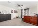 Bright bedroom features a ceiling fan, dressers, floral art, and decorative window treatments at 9050 S Calle Tomi --, Guadalupe, AZ 85283