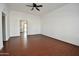 Open and bright living room featuring laminate floors and open access to the kitchen at 9431 W Timberline Dr, Sun City, AZ 85351