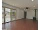 Bright living area with sliding glass doors to the yard, pot belly fireplace, and laminate floors at 9431 W Timberline Dr, Sun City, AZ 85351