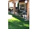 Lush backyard showcasing a well-manicured lawn and an array of potted plants along the covered patio at , Gilbert, AZ 85234