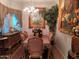 Elegant dining room featuring a decorative chandelier, artwork, and a formal dining set at , Gilbert, AZ 85234