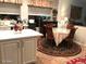 Cozy dining area adjacent to the kitchen with a round table and decorative rug at , Gilbert, AZ 85234