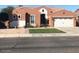 Charming home featuring a well-maintained front yard, a two-car garage and tasteful southwestern architecture at , Gilbert, AZ 85234