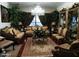 Elegant living room featuring decorative furniture, a chandelier, and large windows that provide natural light at , Gilbert, AZ 85234