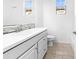 Bright bathroom featuring a modern vanity, tile accents, and natural light at 10064 E Tamery Ave, Mesa, AZ 85212