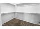 Walk-in closet with carpet and shelves, offering ample storage space at 10064 E Tamery Ave, Mesa, AZ 85212