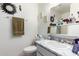 Cozy bathroom with marble countertop, modern fixtures, and decorative towel rack at 10119 N 96Th Ave # B, Peoria, AZ 85345