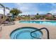 The community pool area features a hot tub and lounge chairs for residents at 10119 N 96Th Ave # B, Peoria, AZ 85345