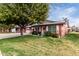 Charming brick home with a white garage, white shutters, and a beautifully landscaped lawn at 10119 N 96Th Ave # B, Peoria, AZ 85345