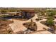 Aerial view of a community center with outdoor seating, walking paths, and recreational facilities at 10233 S Bickwell Trl, Apache Junction, AZ 85120