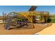 Playground featuring a climbing dome, platforms, and wood chip surfacing at 10233 S Bickwell Trl, Apache Junction, AZ 85120