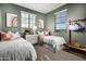 This cheerful bedroom is filled with sunshine and features two twin beds and mountain views at 10255 S Bickwell Trl, Apache Junction, AZ 85120