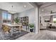 Stylish dining area with modern decor, ample natural light, and an adjacent living space at 10308 S Bickwell Trl, Apache Junction, AZ 85120