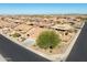 Aerial view of the home highlighting the landscaping in the front and back at 11258 E Ocaso Ave, Mesa, AZ 85212