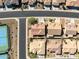 Aerial view showcasing the neighborhood, landscaping, and proximity to the tennis courts at 11258 E Ocaso Ave, Mesa, AZ 85212