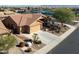 Aerial view showing the home's well-manicured front yard and proximity to tennis courts at 11258 E Ocaso Ave, Mesa, AZ 85212