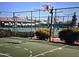 Outdoor community basketball court featuring a chain link fence and landscaping at 11258 E Ocaso Ave, Mesa, AZ 85212