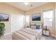 Comfortable bedroom featuring a queen bed, closet, and neutral interior paint at 11258 E Ocaso Ave, Mesa, AZ 85212