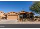 Charming home with a well-maintained desert-scape, a two-car garage, and beautiful, clear, blue skies at 11258 E Ocaso Ave, Mesa, AZ 85212