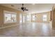 Expansive living room boasting tile floors, plenty of natural light, and elegant chandelier at 11258 E Ocaso Ave, Mesa, AZ 85212