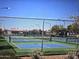 Outdoor pickleball courts featuring professional nets and chain link surround at 11258 E Ocaso Ave, Mesa, AZ 85212