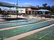 Community shuffleboard courts with covered seating for players and spectators at 11258 E Ocaso Ave, Mesa, AZ 85212