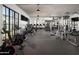 Bright gym with a variety of modern exercise equipment, including treadmills, stationary bikes and weight machines at 11300 N Casa Dega Dr # 1025, Surprise, AZ 85388