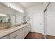 Bathroom featuring double sinks, granite counters, and sliding mirror doors at 11500 E Cochise Dr # 1090, Scottsdale, AZ 85259