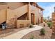 Charming exterior view of the condo building with unique architectural details and beautiful landscaping at 11500 E Cochise Dr # 1090, Scottsdale, AZ 85259