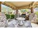 Outdoor grilling area with built in barbecue, sink, and stone accents at 11500 E Cochise Dr # 1090, Scottsdale, AZ 85259