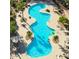 Aerial view of the community pool, complete with palm trees, lounge chairs, and a relaxing atmosphere at 11500 E Cochise Dr # 1090, Scottsdale, AZ 85259