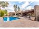 Enjoy the pool and patio area with a unique stone design at 122 E Loma Vista Dr, Tempe, AZ 85282