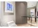 Powder room featuring a vessel sink on a glass countertop, modern toilet, and artistic décor at 122 E Loma Vista Dr, Tempe, AZ 85282