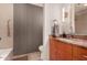 This bathroom offers a granite counter top with warm wooden cabinets at 122 E Loma Vista Dr, Tempe, AZ 85282