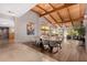 Dining room showcasing vaulted ceilings, hardwood floors, and modern chandelier lighting at 122 E Loma Vista Dr, Tempe, AZ 85282