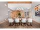 Dining area showcasing vaulted ceilings, hardwood floors, and artistic wood wall design at 122 E Loma Vista Dr, Tempe, AZ 85282