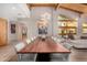 Elegant dining area featuring vaulted ceilings, large windows, and an eye-catching chandelier at 122 E Loma Vista Dr, Tempe, AZ 85282