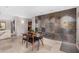 Dining room with a glass table, stylish chairs, and an accent wall at 122 E Loma Vista Dr, Tempe, AZ 85282