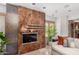 Close-up of modern fireplace in living room with stone surround and contemporary accents at 122 E Loma Vista Dr, Tempe, AZ 85282