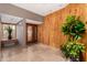 Inviting foyer with artistic wood wall design, stylish tile floors, and contemporary lighting at 122 E Loma Vista Dr, Tempe, AZ 85282