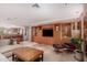 Inviting living room featuring travertine floors, stylish decor and custom wood cabinetry at 122 E Loma Vista Dr, Tempe, AZ 85282