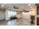 Bright and airy bonus room showcasing modern ceiling fans, neutral paint, and open space for flexible living at 12426 W Cougar Dr, Sun City West, AZ 85375